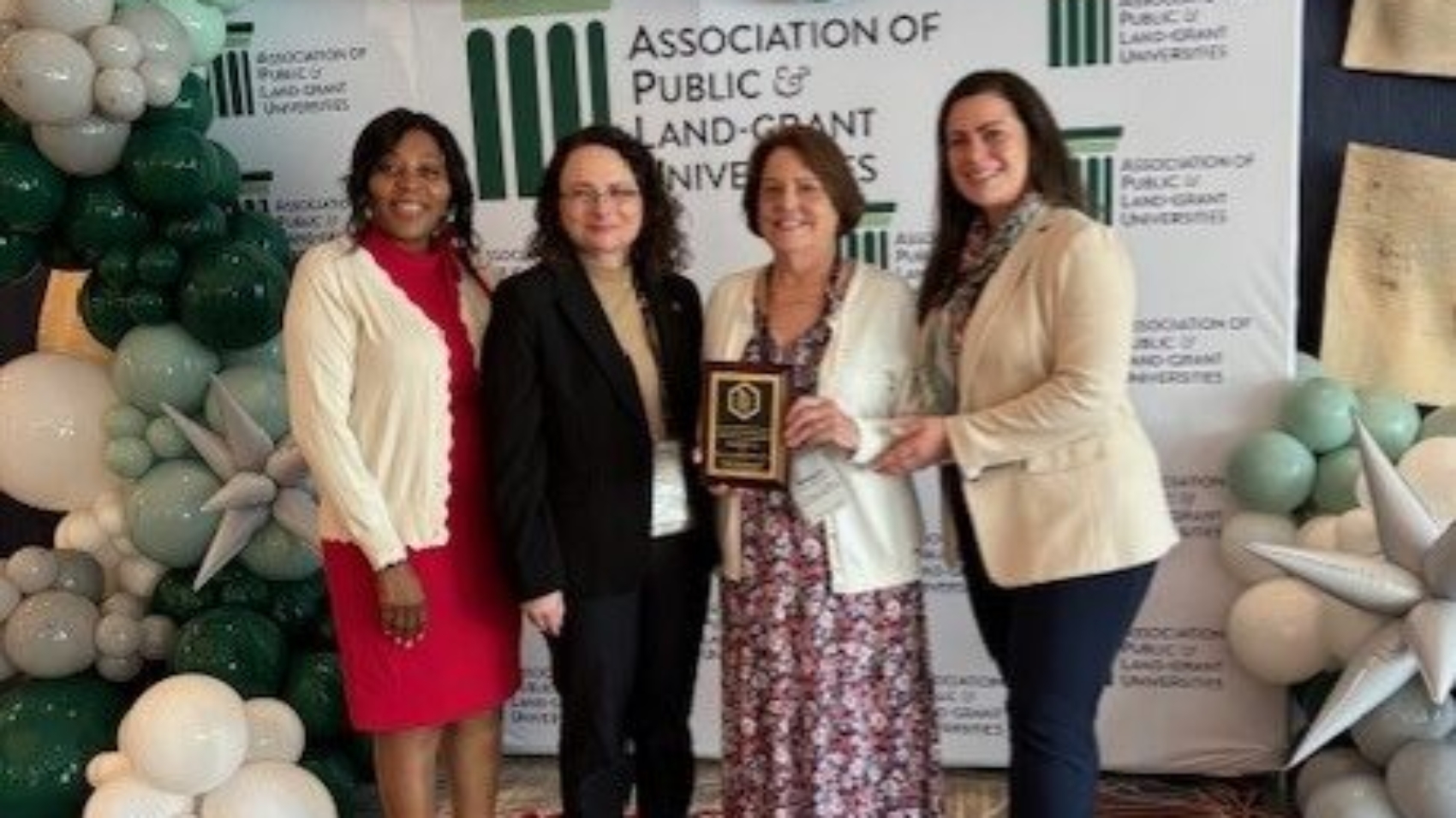 APLU_Chancellor_Brennan-et-al_at-meeting-e1733252785565.jpg