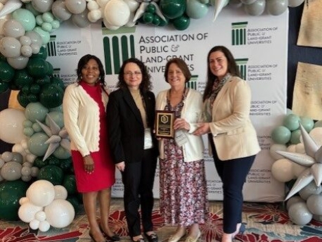 APLU_Chancellor_Brennan-et-al_at-meeting-e1733252785565.jpg