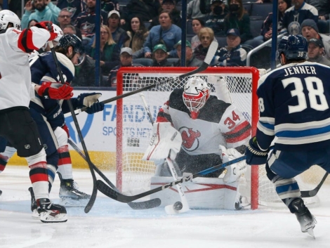 Jake_Allen_making_save_white_Devils_jersey_Blue_Jackets_March_2025
