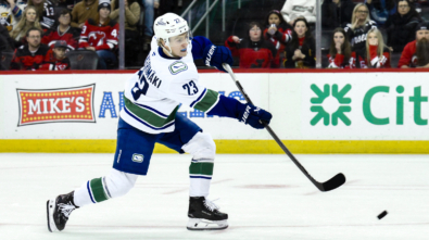 Mar 24, 2025; Newark, New Jersey, USA; Vancouver Canucks right wing Jonathan Lekkerimaki (23) shoots and scores a goal during tovertime shootouts against the New Jersey Devils at Prudential Center. Mandatory Credit: John Jones-Imagn Images