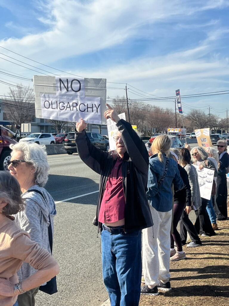 Hitting the Streets: NJ Protesters Call on Consumers to Boycott Tesla