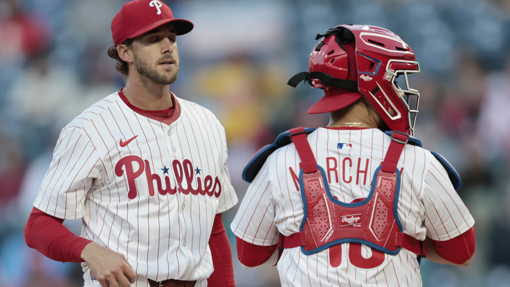 Phils pitcher Aaron Nola and catcher Rafael Marchan wait for a coach during a meeting on the mound in the first inning of the San Francisco Giants at Philadelphia Phillies Major League Baseball game at Citizens Bank Park in Philadelphia on Wednesday, April 16, 2025.