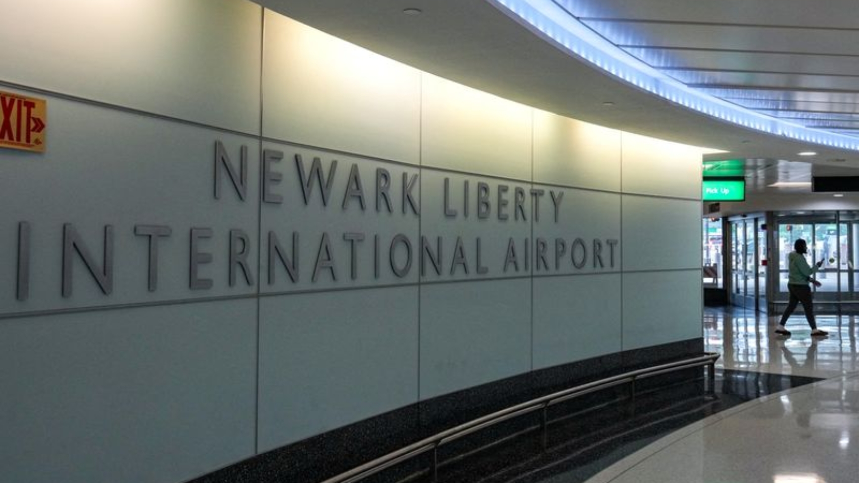 FILE PHOTO: A person walks in Terminal B at Newark Liberty International Airport in Newark, New Jersey, U.S., May 9, 2025. REUTERS/David 'Dee' Delgado/File Photo
