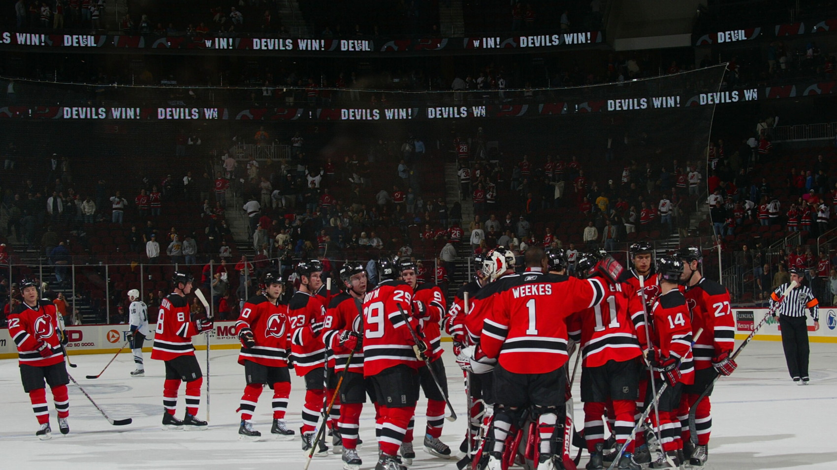 NEWARK, NJ - OCTOBER 31: The New Jersey Devils celebrate a 6-1 victory over the Tampa Bay Lightning October 31, 2007 at the Prudential Center in Newark, New Jersey.  (Photo by Bruce Bennett/Getty Images)