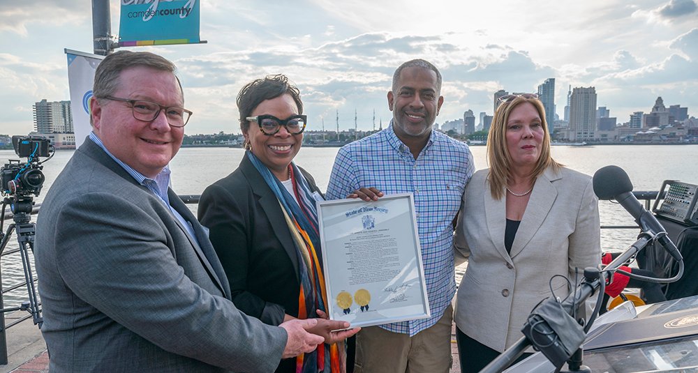 Camden Community Partnership marked its 40th anniversary serving the city during a special reception at the Wiggins Waterfront Marina. From left: Mark McDonough, president of New Jersey American Water and CCP co-chair; Dana Redd, president and CEO of CCP; Camden Mayor Victor Carstarphen; and Sen. Nilsa Cruz-Perez, D-5th District.
