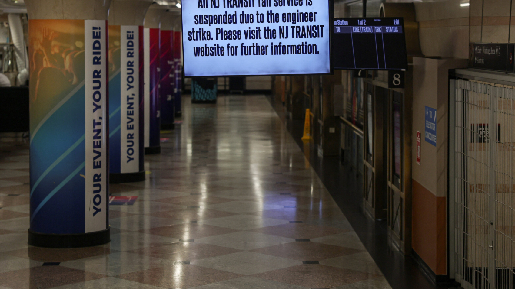 A signage displays a warning of no transit service in New Jersey due to a planned strike in New York's Penn Station in New York, U.S., May 16, 2025. REUTERS/Jeenah Moon