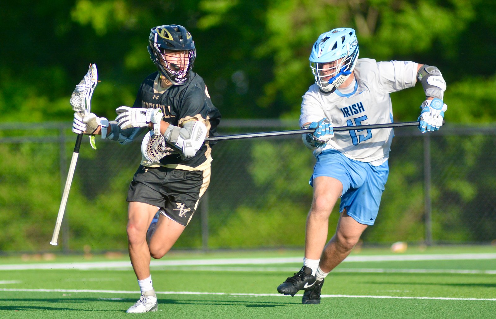 Hopewell Valley’s Luke Caldwell, left, tries to move away from...