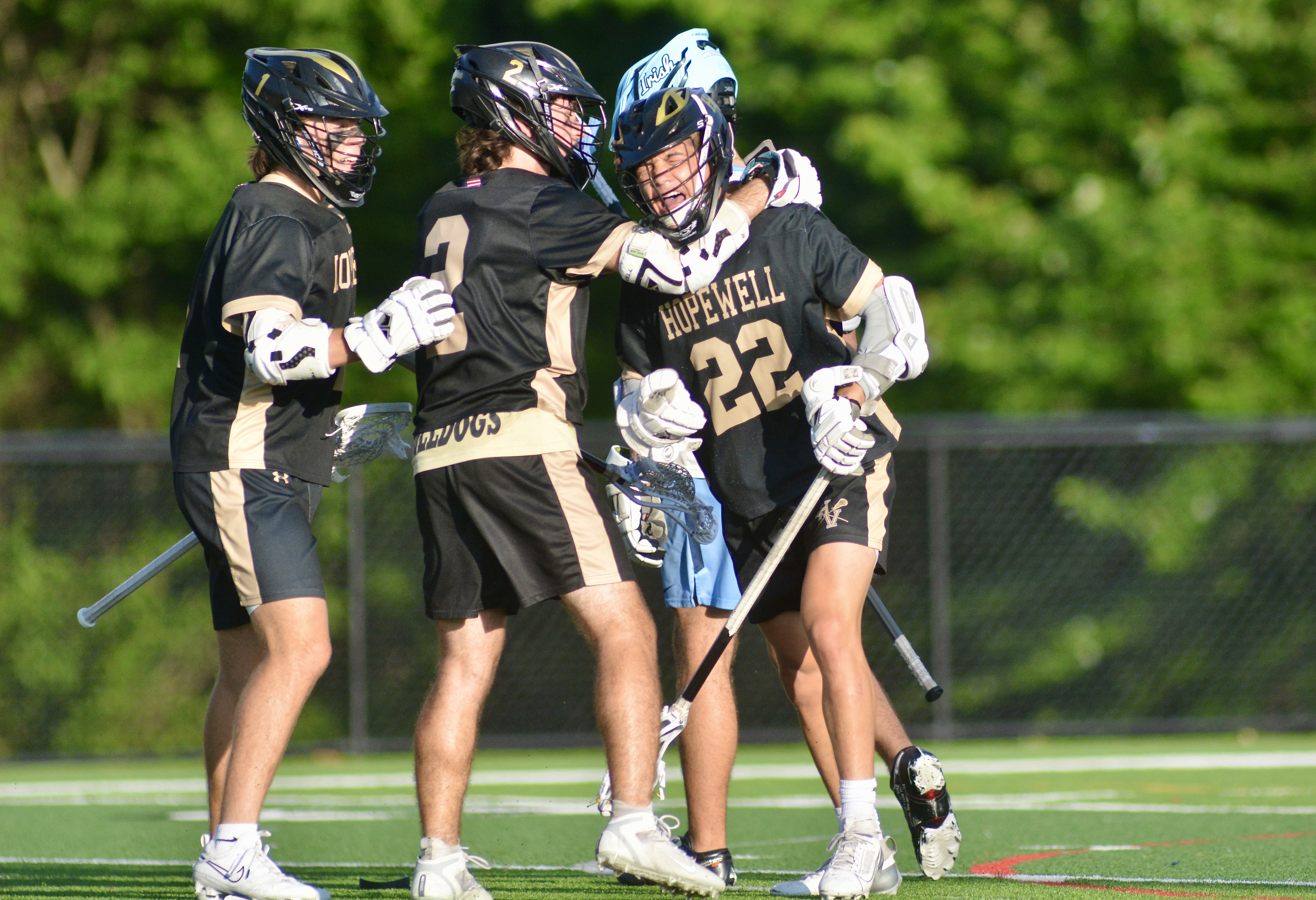 Hopewell Valley’s Luke Caldwell, right, celebrates his goal with teammates...