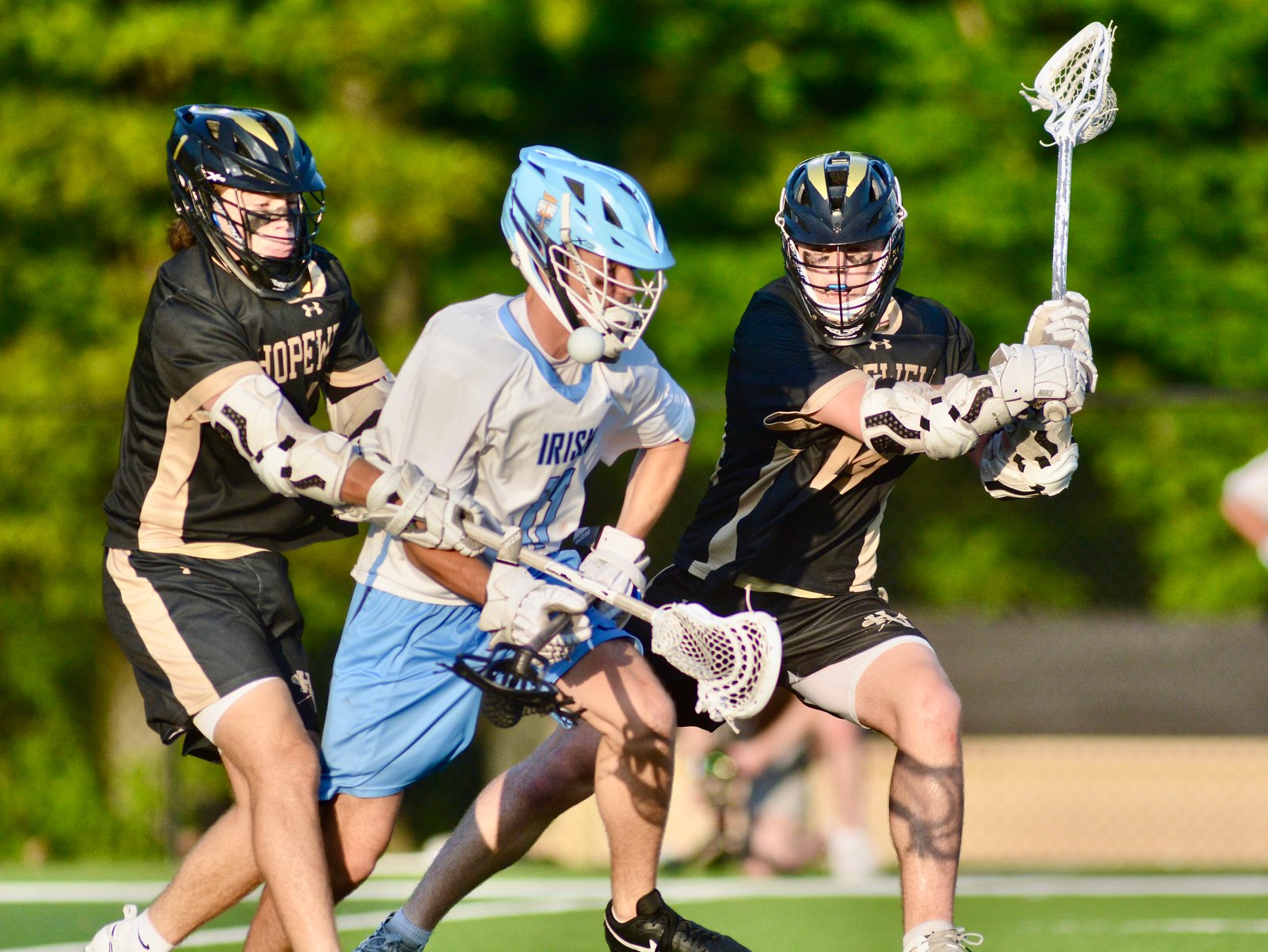 Notre Dame’s Jay Benjamin, center, tries to corral the ball...
