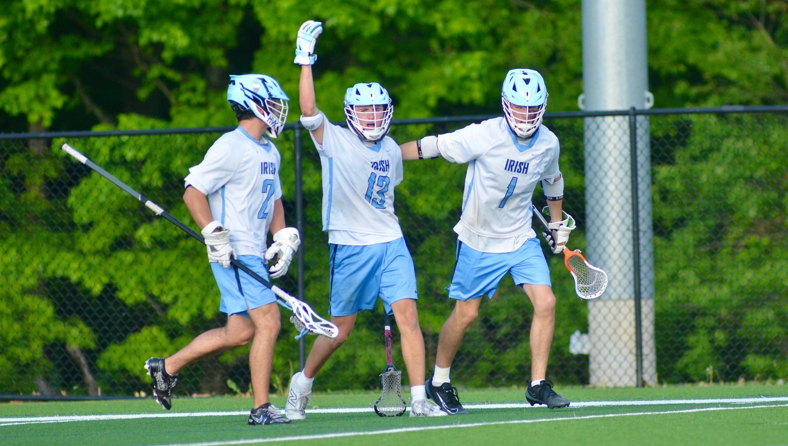 Notre Dame’s Kenny Romano, center, celebrates his goal with teammates...