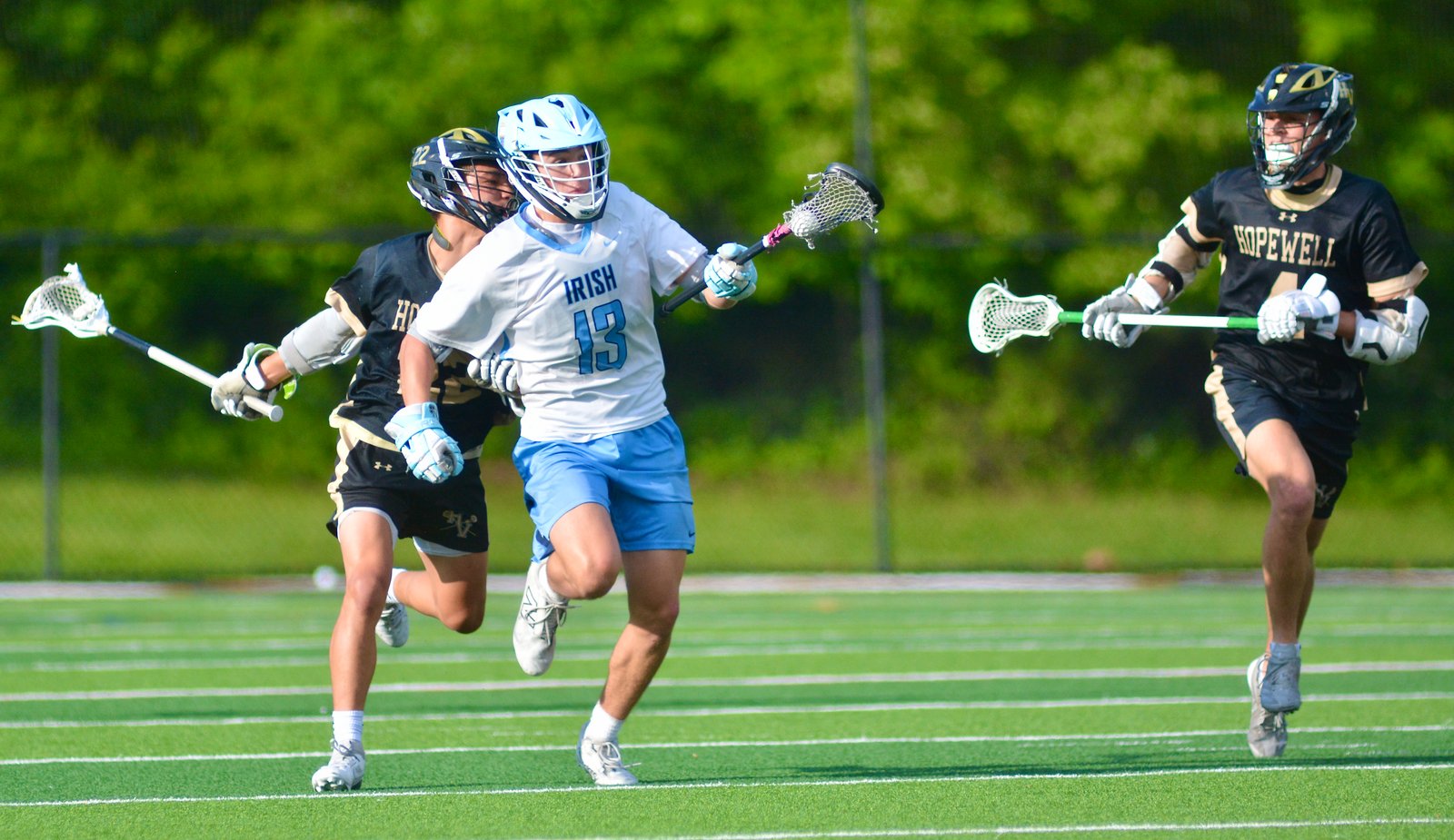 Notre Dame’s Kenny Romano, center, runs away from Hopewell Valley’s...