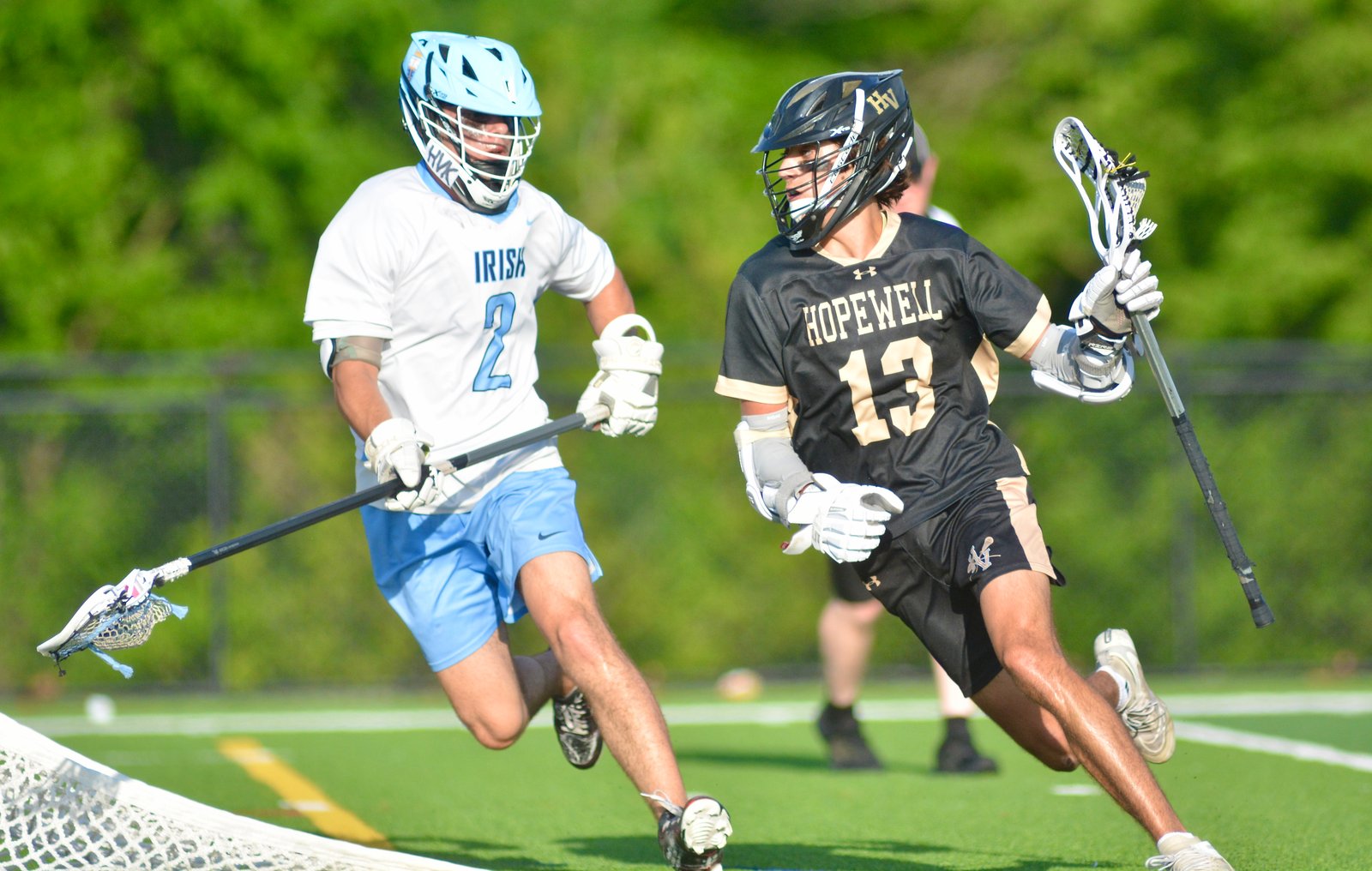Hopewell Valley’s Ryan Foret, right, dodges to the cage as...