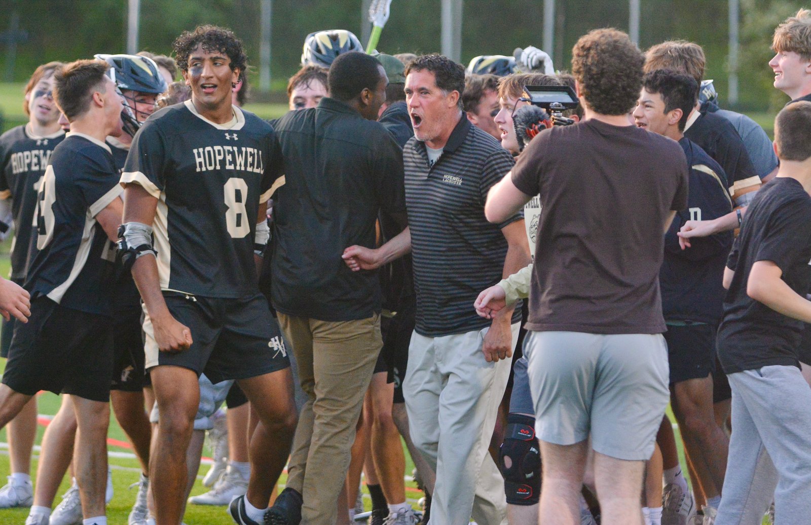 Hopewell Valley defender Milan Desai, left, and coach Matthew Foret,...