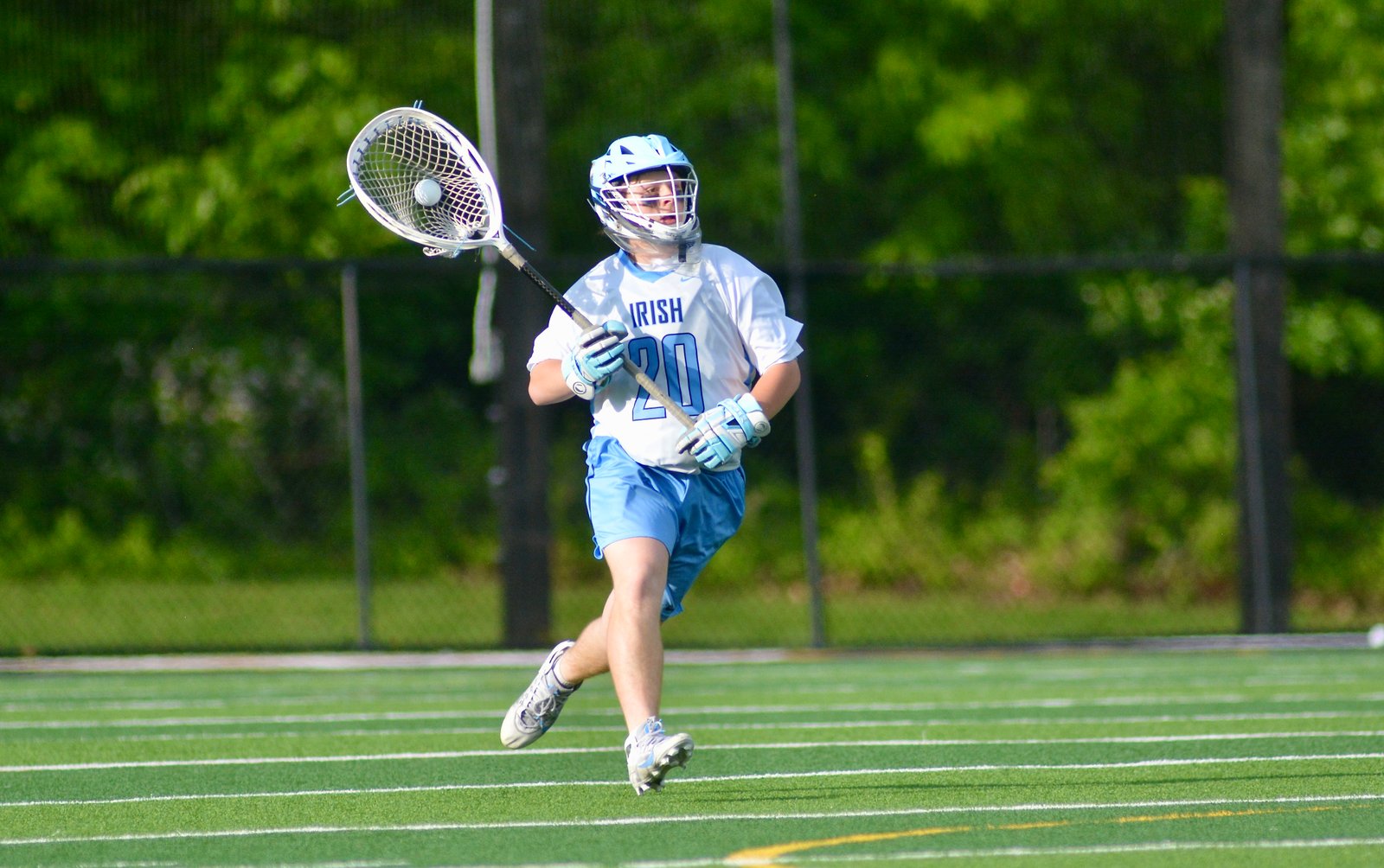 Notre Dame goalie Vincenzo Labianca runs the ball up the...