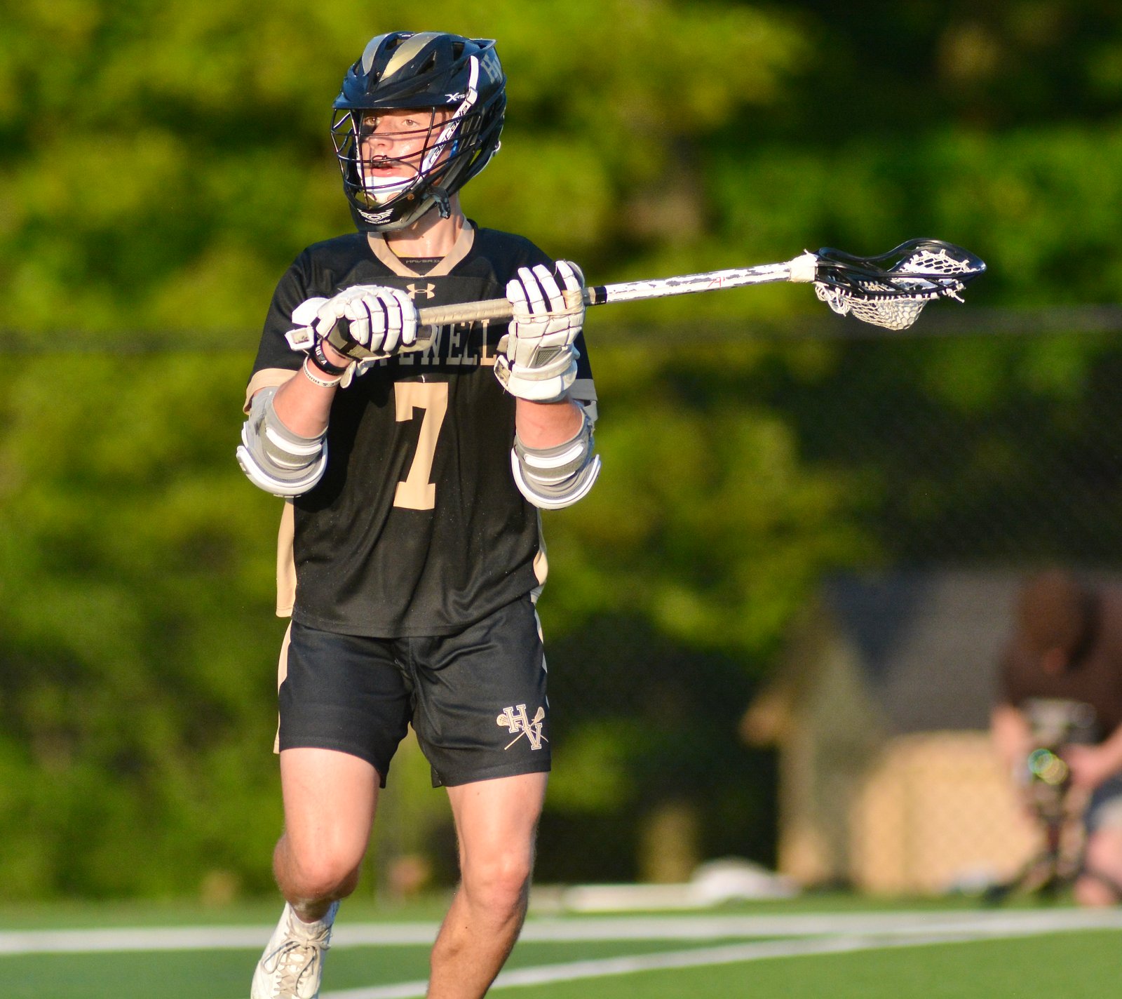 Hopewell Valley’s Joseph Demareski looks to pass the ball to...