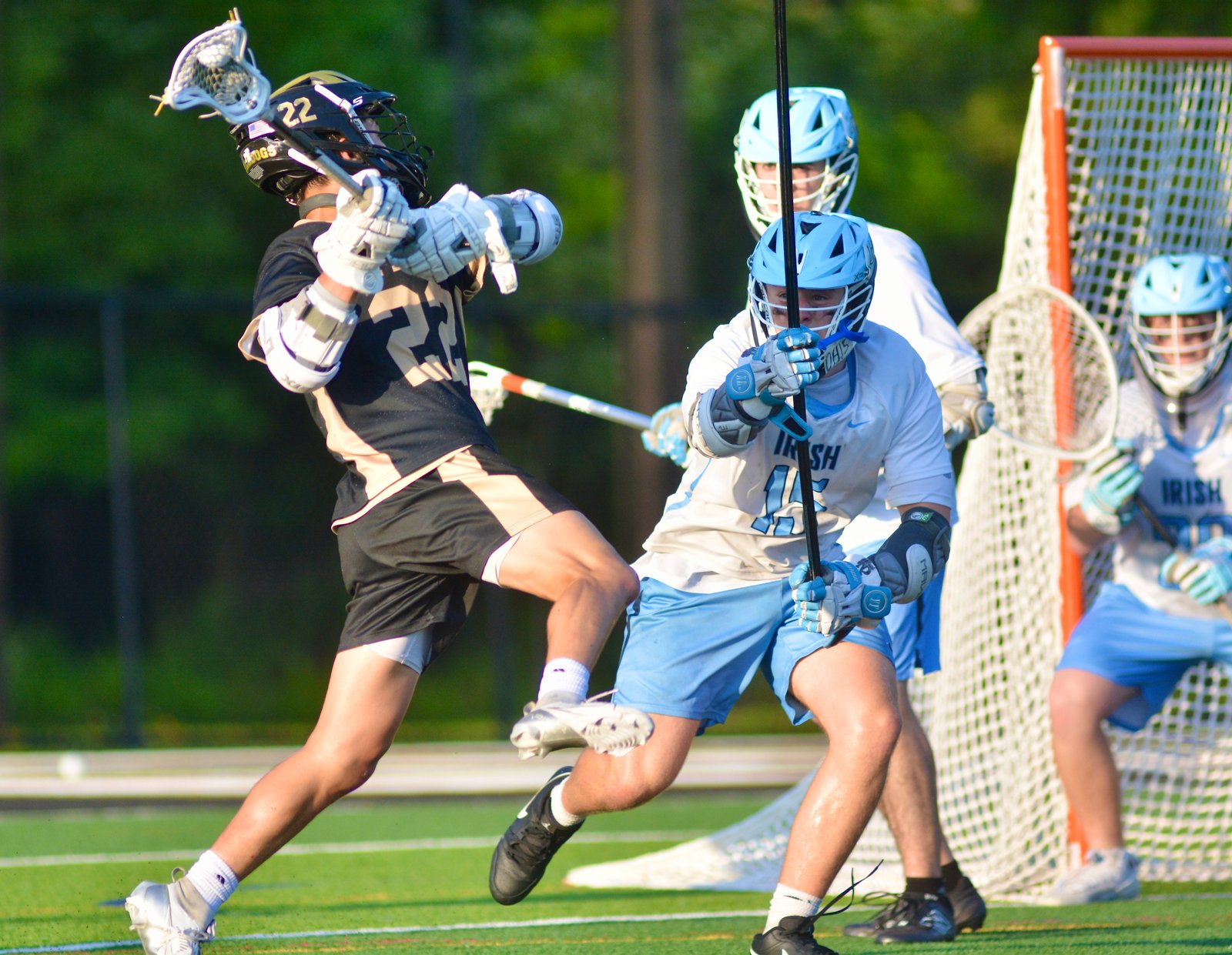 Hopewell Valley’s Luke Caldwell, left, shoots and scores as Notre...