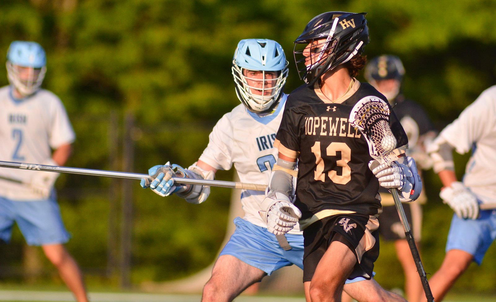 Hopewell Valley’s Ryan Foret, right, tries to move around the...