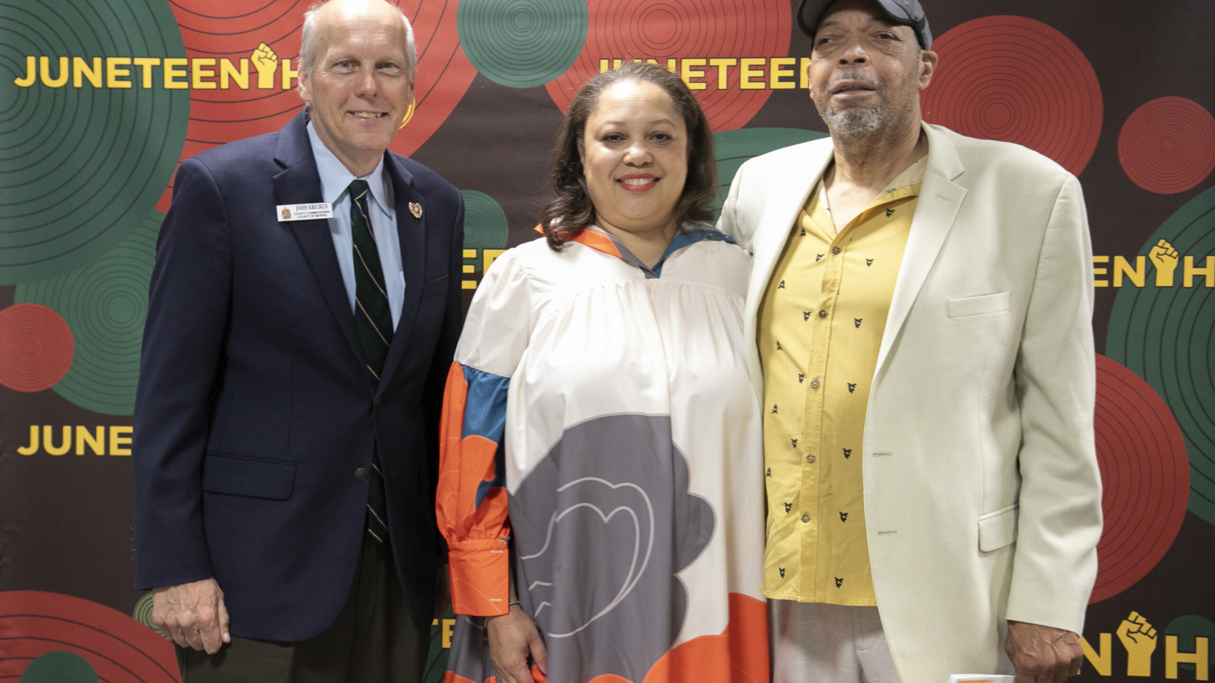 From left, Morris County Commissioner John Krickus, Simone Craig, CEO of Art in the Atrium, Inc., and Curator Onnie Strother. More than 75 Black and Afro-Latino artists are being showcased in the 33rd annual Art in the Atrium (ATA) exhibit, “Another Slice of Sweet Potato Pie,” which officially opened tonight with a public reception at the Morris County Administration and Records Building.
The exhibit is a signature event of the Juneteenth Arts Celebration, a three-day series organized in partnership with ATA, the Mayo Performing Arts Center (MPAC), Morris Arts and Morris Museum.