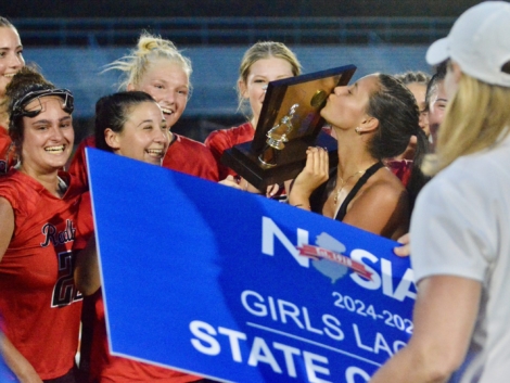 Injured Allentown senior Charley Wojtowicz kisses the championship trophy after...