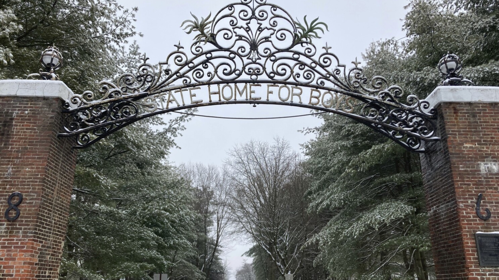 The gate outside the New Jersey Training School carries a bygone name for the facility, Tuesday, Jan. 16, 2024, in Monroe Township, N.J. The New Jersey youth detention center let a “culture of abuse,” in which staff sexually abused boys, endure for decades, according to a lawsuit filed Wednesday, Jan. 17 in state Superior Court by 50 men who lived at the facility. (AP Photo/Mike Catalini, File)