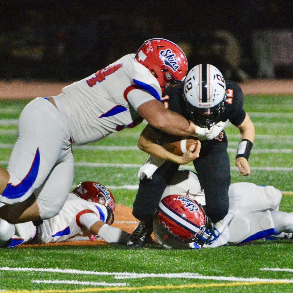 Pennsbury quarterback Jack Arndt, 12, is tackled by Neshaminy’s Dan...