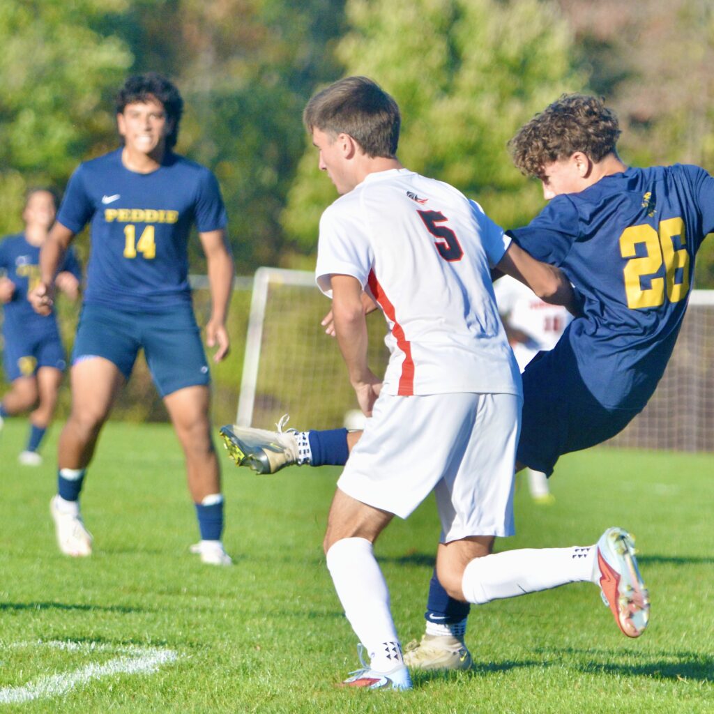 Peddie’s Blake Romanelli, right, takes a shot as Pennington’s Finn...