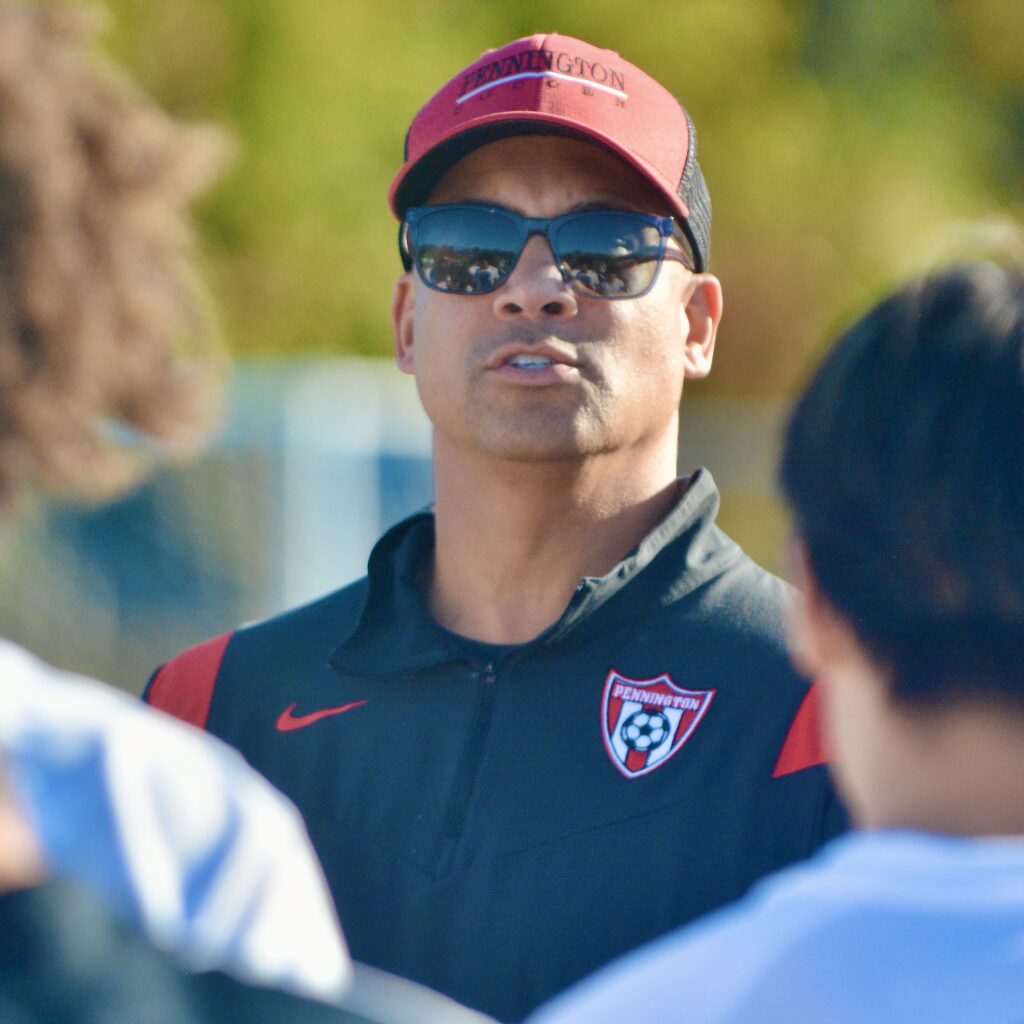 Pennington coach Chad Bridges talks to his team on the...
