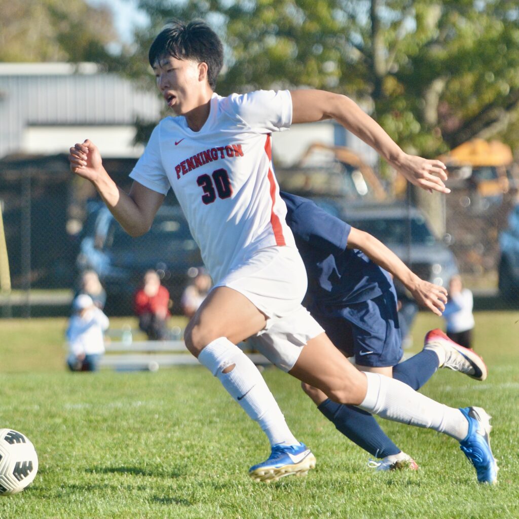 Pennington’s Daniel Youn, 30, moves with the ball against Peddie...