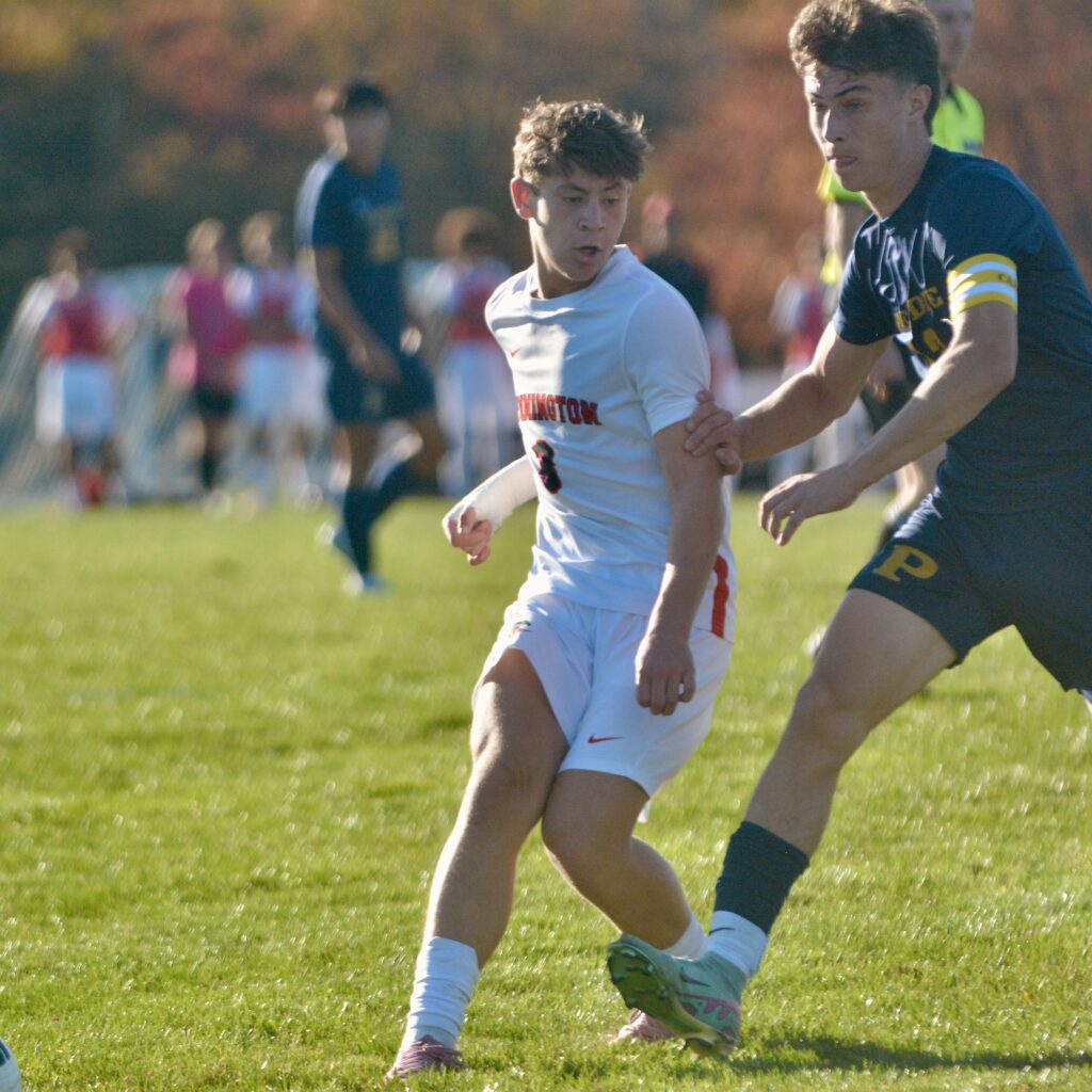 Pennington’s Joey Riley, left, tries to shield the ball away...