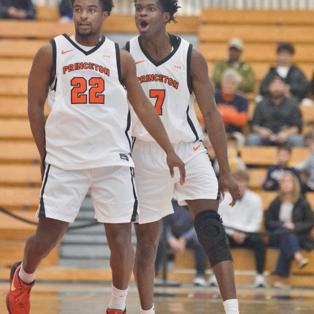 Princeton’s Dalen Davis, left, and Malik Abdullahi, right, react after...