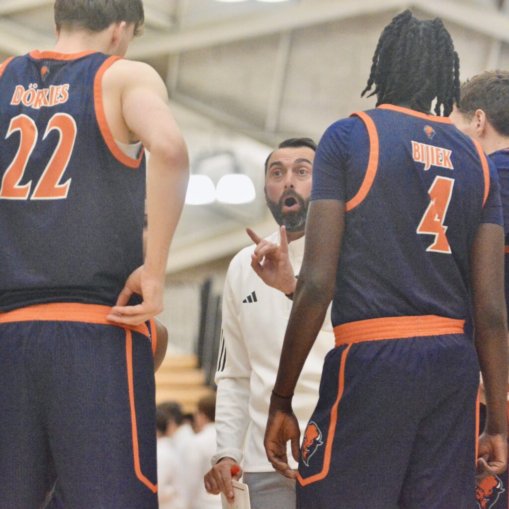 Bucknell coach John Griffin III talks to his team against...