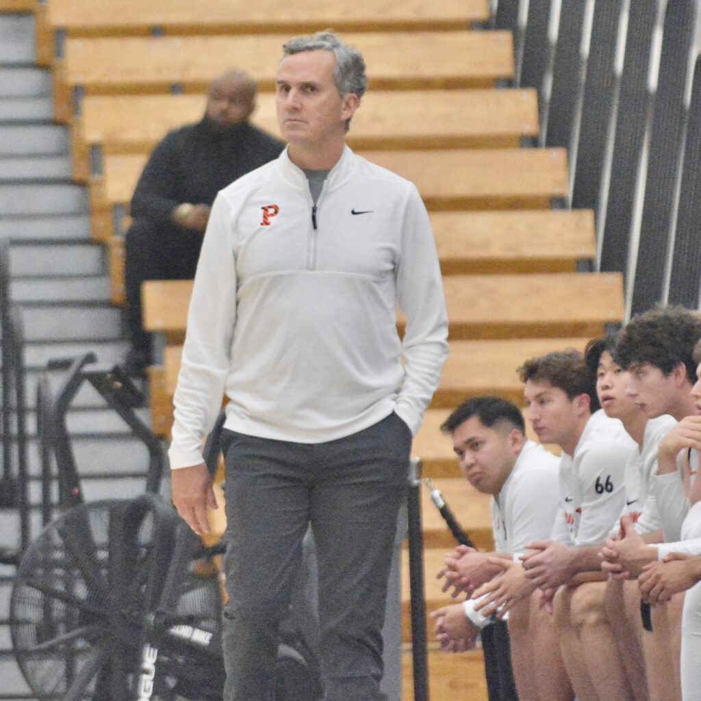 Princeton coach Mitch Henderson walks along the sideline against Bucknell...