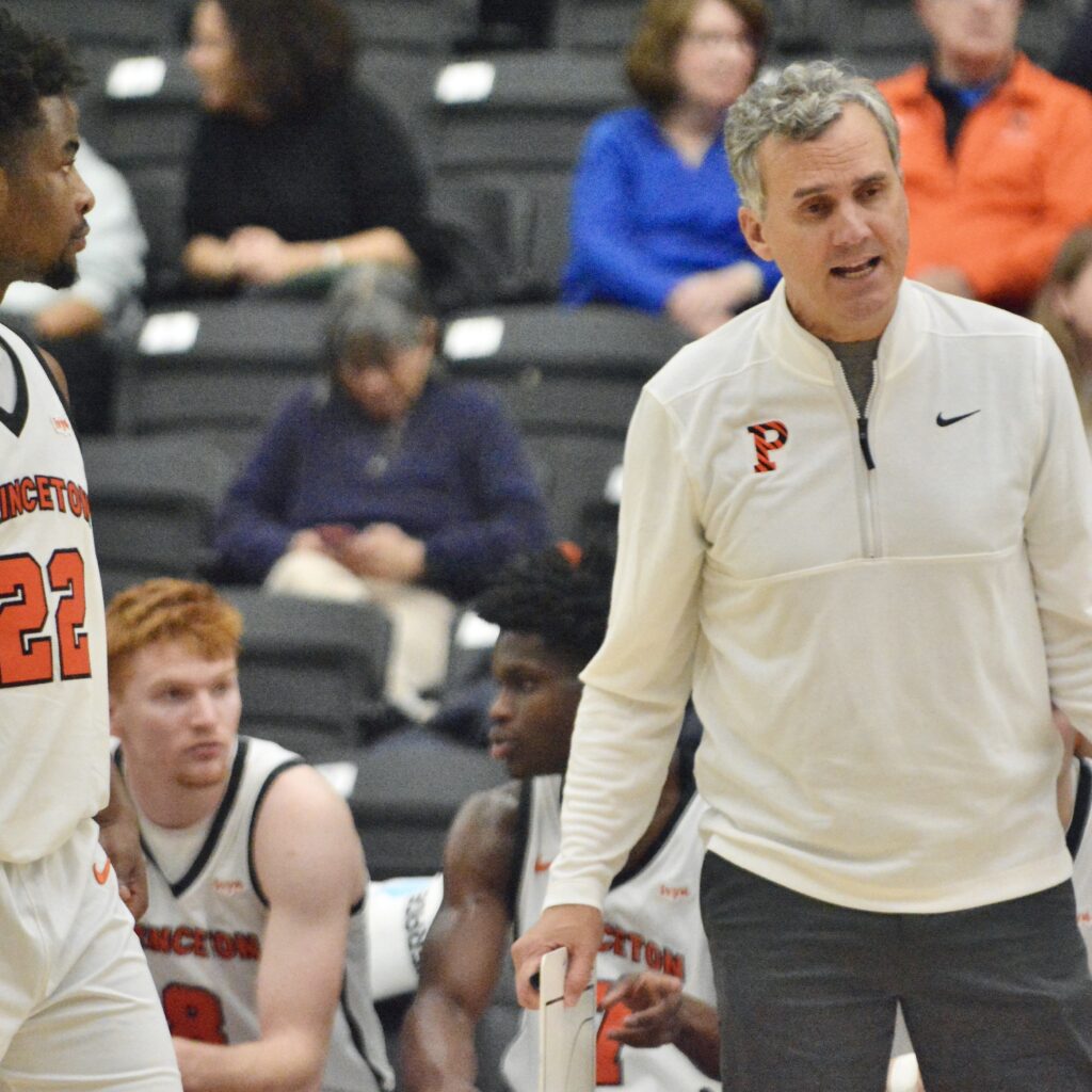 Princeton coach Mitch Henderson, right, talks with guard Dalen Davis,...