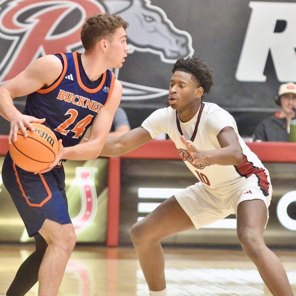 Rider’s AB Coulibably, right, defends against Bucknell’s Achile Spadone, left,...