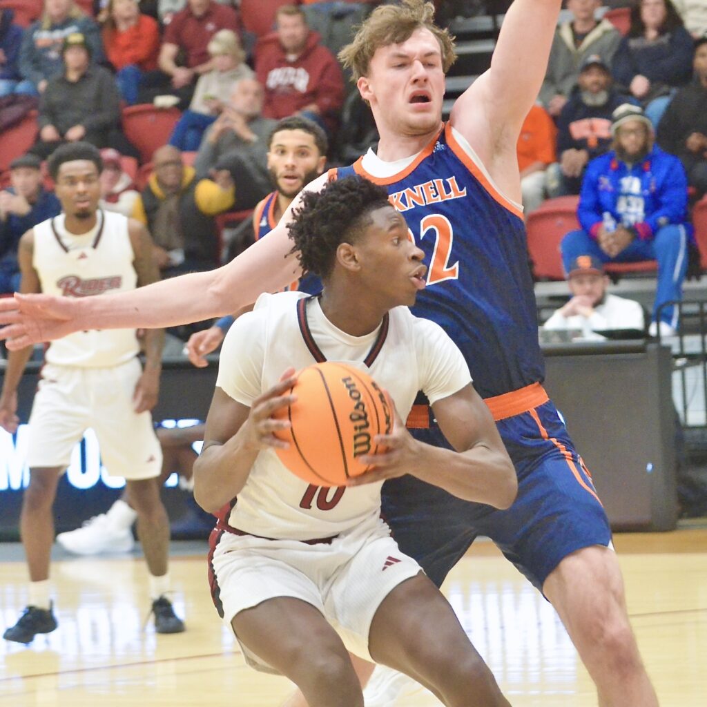 Rider’s AB Coulibaly, 10, drives to the basket as Bucknell’s...