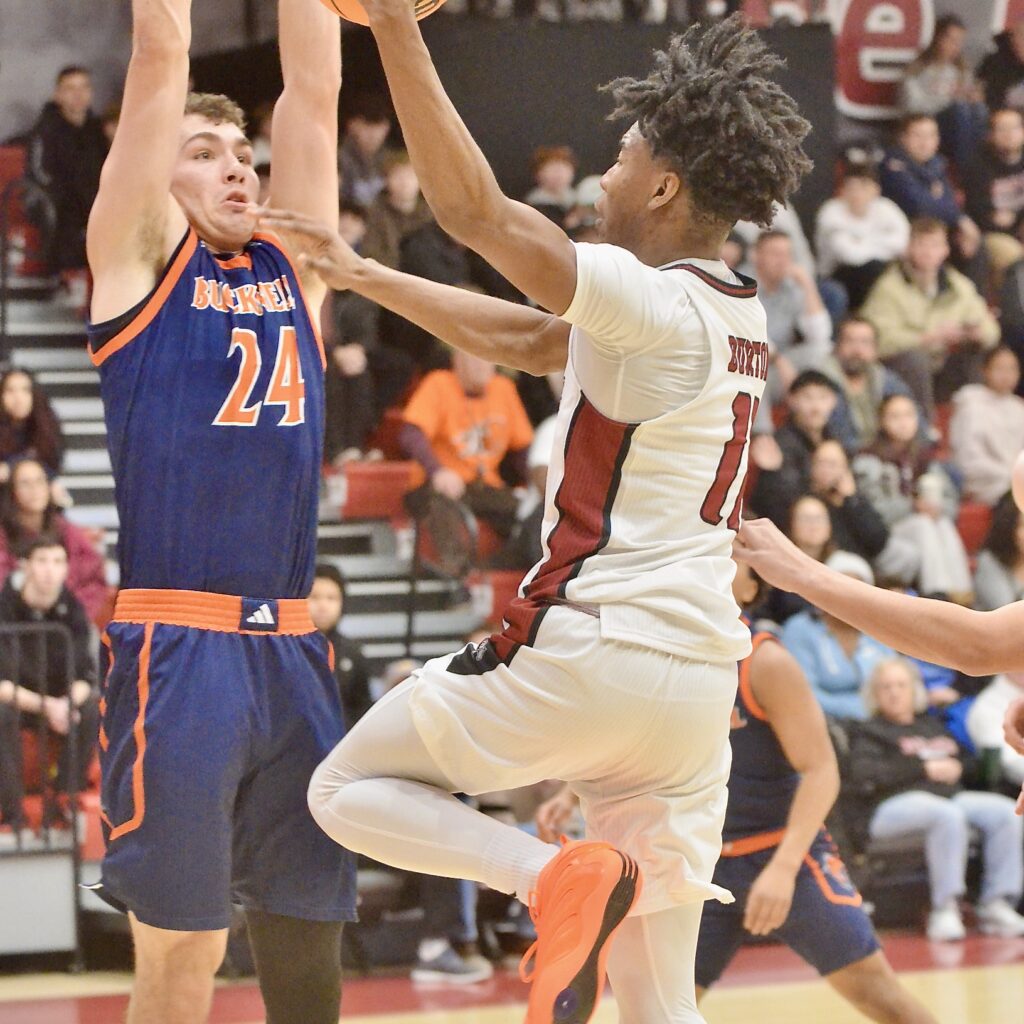 Rider’s Flash Burton, 11, goes up for a shot as...